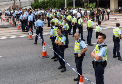 Protesters and Police officers outside the Hong Kong Queensway Pacific Place on October 13, 2014.