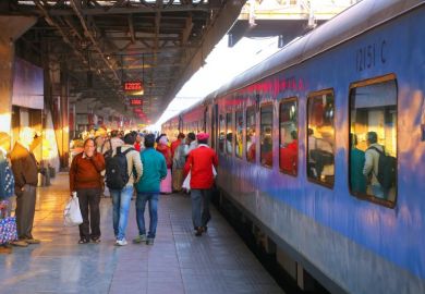 People walking at Jaipur Junction railway station in Rajasthan.