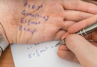 Test answers written on the palm of a hand