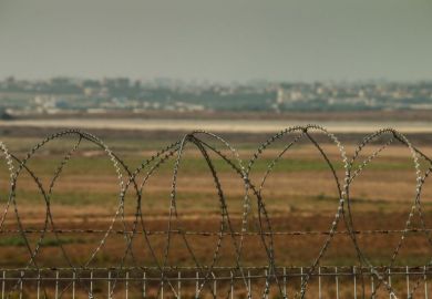 Barbed wire fence between Israel and the West Bank Barbed wire fence between Israel and the West Bank