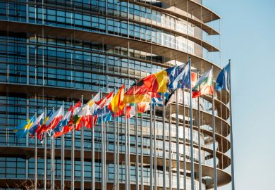 The European Parliament building in Strasbourg, France with flags waving on a spring evening The European Parliament building in Strasbourg, France with flags waving on a spring evening