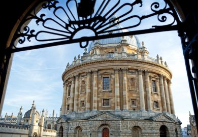 A view of the Radcliffe Camera through a gate at the University of Oxford A view of the Radcliffe Camera through a gate at the University of Oxford in England