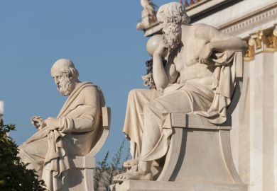 classic statues of Plato and Socrates