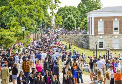 Crowd of people walking by amphitheater at graduation ceremony at University of Virginia Crowd of people walking by amphitheater at graduation ceremony at University of Virginia