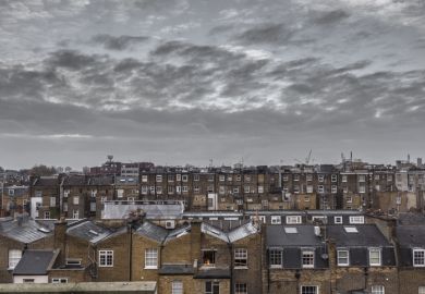 Classic rooftops in London with grey sky and clouds
