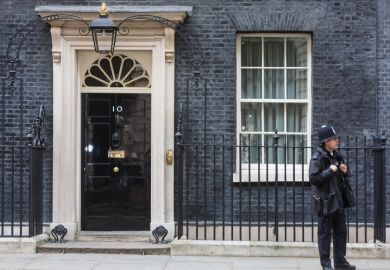 A police officer outside No.10 Downing Street, London A police officer outside No.10 Downing Street, London