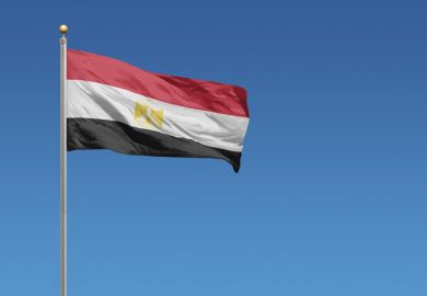 Egyptian flag in front of blue sky
