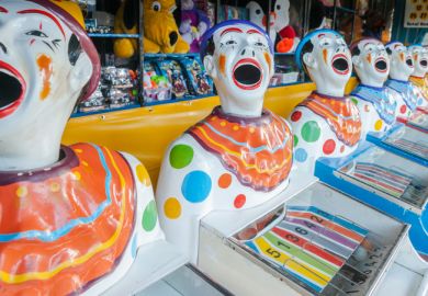 A row of sideshow carnival game clowns with mouths open