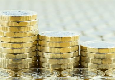  British money, three pound coins descending stacks.