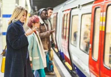 Commuters waiting for the train at an underground station