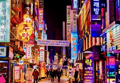 Road with bright neon signs in Seoul Road with bright neon signs in Seoul