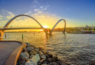 Elizabeth Quay Bridge at sunset light on Swan River at entrance of Elizabeth Quay marina in Perth