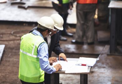 Factory owner deciding on the potential to improve his factory with the engineers, ready with his pen in hand