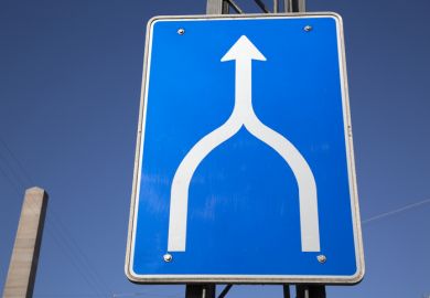 Road sign showing two roads converging into one