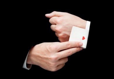 A conjuror pulls the ace of hearts out of his sleeve card trick sleight of hand ace up the sleeve illusion