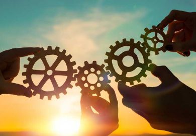 istock-cog-hands-sunset