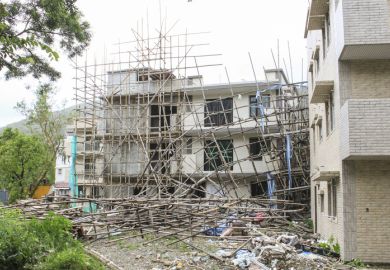 collapse scaffold scaffolding damage destruction construction fall over fall down symbolising collapse of English language colleges