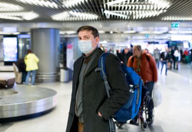 coronavirus face-mask arrival hall airport