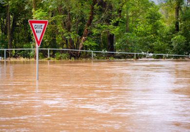 flood disaster Australia Give Way sign inundation