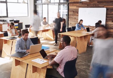 hot desks open plan office workers busy