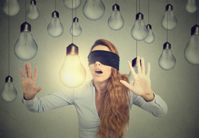 Blindfolded woman can’t see light bulb in front of her oblivious unaware blind bright ideas light bulbs blindfold