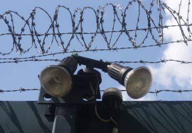 Razor wire and searchlights