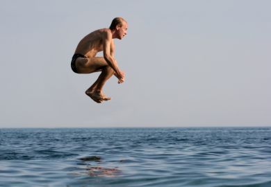 Man jumping into water