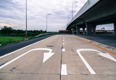 U-turn sign painted on road