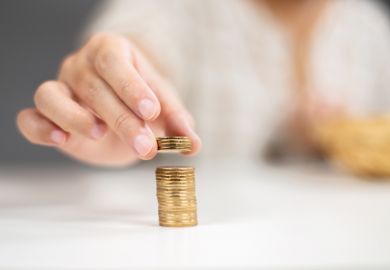 Man stacking coins, refund