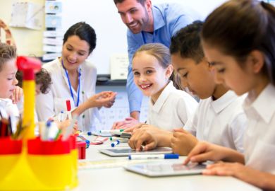 Teacher and pupils in class