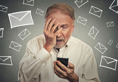 Stressed man holding cell phones