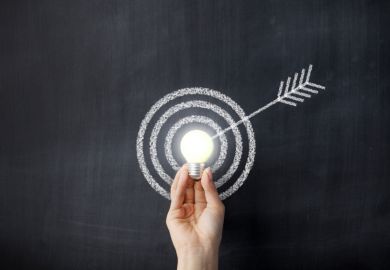 Arrow hitting a lightbulb