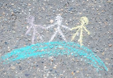 Chalk figures holding hands on a globe