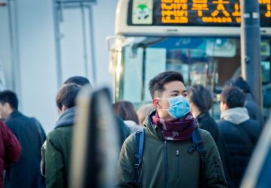 istock Japan coronavirus Man wearing mask on the street at rush hour in Japan