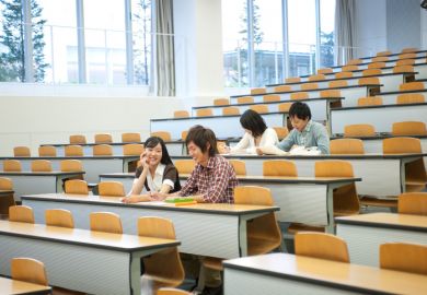 Japanese students sitting in a university lecture theatre