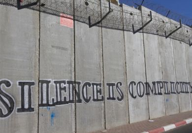 Jerusalem, Israel, November 23, 2010 Graffiti on the concrete wall built by Israel to stop West Bank Palestinians from commuting in East Jerusalem 
