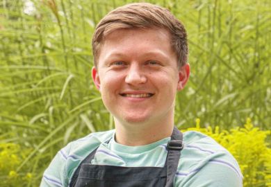 Josh Smalley in an apron that says University of Leicester