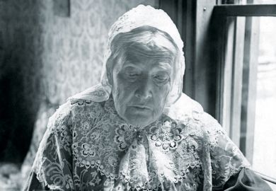 Julia Ward Howe writing at desk, 1906