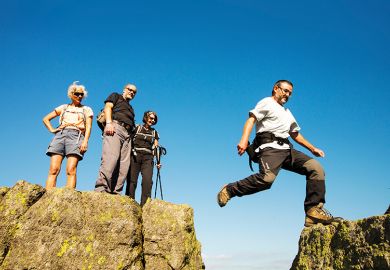Man jumping across rocks