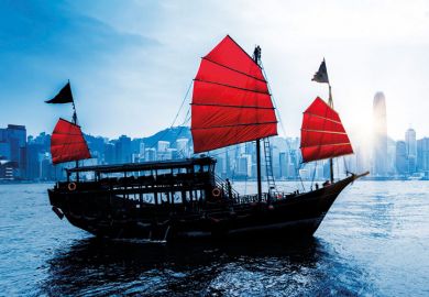 Junk sailing in Hong Kong harbour Junk sailing in Hong Kong harbour