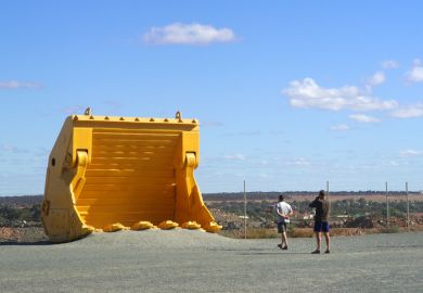 Kalgoorlie, Australia - May 18, 2007 mechanical shovel with the goldmine of Kalgoorlie to show to the tourist the real size of the machine
