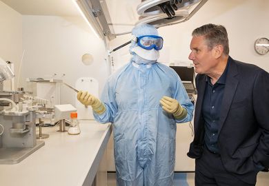 Keir Starmer speaks with a research scientist. To illustrate the Increased efforts made by universities to highlight the importance of quality-related (QR) research funding.