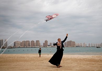 Flying kite on beach