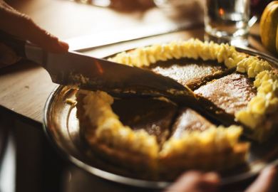 Knife cutting pie into slices