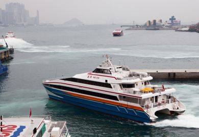 Kowloon, Hong Kongaa March 15 2013 Passenger Ferry to China leaves Kowloon terminal, Hong Kong on March 15th, 2013