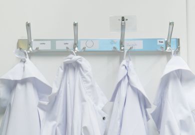 Lab coats on pegs Lab coats on pegs