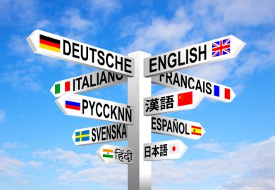 A signpost with the names of different languages on it A signpost with the names of different languages on it