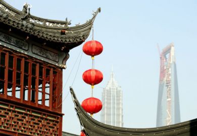 Lanterns hanging from temple roof, Shanghai Red lanterns hanging from a temple roof in Shanghai