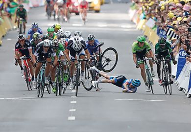 Garmin-Sharp team rider Andrew Talansky of the U.S. crashes during  the Tour de France cycling race 