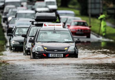 Learned driver on flooded road